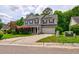 Inviting two-story house with an attached garage and lush landscaping at 1039 Steelechase Ln, Hanahan, SC 29410