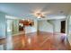 Expansive living area showcasing hardwood floors, an open kitchen, and natural light at 1039 Steelechase Ln, Hanahan, SC 29410
