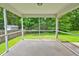 Screened-in patio with concrete floor and backyard views at 1039 Steelechase Ln, Hanahan, SC 29410