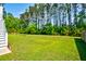 Expansive backyard features lush green grass and mature trees for privacy at 104 Antilles Cir, Charleston, SC 29492