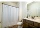 Bathroom features a shower-tub combo, a vanity with bronze fixtures, and neutral walls at 104 Antilles Cir, Charleston, SC 29492