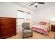 A lovely bedroom with a recliner, wood floors, and natural light coming through the windows at 104 Antilles Cir, Charleston, SC 29492