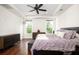 A lovely bedroom with wood floors, a ceiling fan, and natural light coming through the windows at 104 Antilles Cir, Charleston, SC 29492