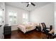 A well-lit bedroom featuring a comfortable bed, wood floors, and natural light at 104 Antilles Cir, Charleston, SC 29492