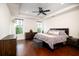 A well-lit bedroom with wood floors, recessed lighting, and a comfortable bed with bedside tables at 104 Antilles Cir, Charleston, SC 29492