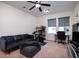 Upstairs bonus room with home gym, TV, sofa, and desk at 104 Antilles Cir, Charleston, SC 29492