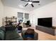 Upstairs bonus room with home gym, TV, sofa, and desk at 104 Antilles Cir, Charleston, SC 29492