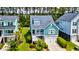 Bright home with a white porch, two-car garage, and manicured lawn at 104 Antilles Cir, Charleston, SC 29492