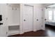 Hallway leading to a bedroom with storage bench and coat hooks at 104 Antilles Cir, Charleston, SC 29492