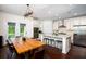 Kitchen and dining area showcasing stone countertops and stainless steel appliances at 104 Antilles Cir, Charleston, SC 29492