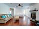 A spacious living room features a fireplace, hardwood floors, and bright lighting at 104 Antilles Cir, Charleston, SC 29492