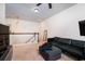 Second floor living room with carpet floors, a leather couch, and a TV at 104 Antilles Cir, Charleston, SC 29492