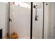 A bright, tiled shower with black hardware and a glass door at 104 Antilles Cir, Charleston, SC 29492