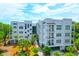 Stunning aerial view of a luxury condo building with beautiful landscaping and modern architecture at 108 Fairbanks Oak Aly # 401, Charleston, SC 29492
