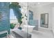 Bright bathroom with freestanding tub, large shower, statement mirror and great natural light at 108 Fairbanks Oak Aly # 401, Charleston, SC 29492