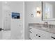 Bright bathroom features a vanity with granite countertop, modern lighting, and a separate glass-enclosed shower at 108 Fairbanks Oak Aly # 401, Charleston, SC 29492