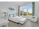 Bright bedroom with hardwood floors, great light, desk, and decorative accent wall at 108 Fairbanks Oak Aly # 401, Charleston, SC 29492