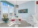 Bright dining area featuring large windows, modern light fixtures, seating for six, and views of outside at 108 Fairbanks Oak Aly # 401, Charleston, SC 29492