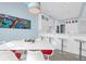 Bright kitchen featuring a large island, modern chairs, and dining area at 108 Fairbanks Oak Aly # 401, Charleston, SC 29492