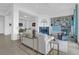 Bright living room with white sofa, blue fireplace, and built-in shelving at 108 Fairbanks Oak Aly # 401, Charleston, SC 29492
