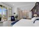 Serene main bedroom with balcony access, custom cabinets, hardwood floors, and crane wallpaper at 108 Fairbanks Oak Aly # 401, Charleston, SC 29492