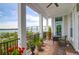 Covered porch boasting beautiful plants and river views at 108 Fairbanks Oak Aly # 401, Charleston, SC 29492
