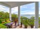 Covered porch with comfortable seating and expansive views of the ocean at 108 Fairbanks Oak Aly # 401, Charleston, SC 29492