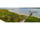 Breathtaking waterfront view with a private dock, serene landscape, and clear blue waters at 108 Fairbanks Oak Aly # 401, Charleston, SC 29492