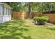 View of backyard showcasing the privacy fence and manicured lawn at 109 New Spring Ct, Summerville, SC 29485