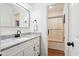 Clean bathroom with a granite countertop, single sink vanity, and a view of the shower at 109 New Spring Ct, Summerville, SC 29485