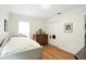 Bright bedroom featuring wood floors, a comfortable bed, and a traditional-style dresser at 109 New Spring Ct, Summerville, SC 29485