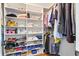 Organized walk-in closet with shelves, rods, and a variety of clothing and storage items at 109 New Spring Ct, Summerville, SC 29485