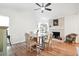 Bright dining room with brick fireplace, ceiling fan, and outdoor views at 109 New Spring Ct, Summerville, SC 29485