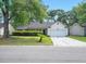 Traditional one-story home featuring a well-maintained front yard with mature trees at 109 New Spring Ct, Summerville, SC 29485