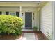 Inviting front entry featuring gray door, white trim, and manicured landscaping at 109 New Spring Ct, Summerville, SC 29485