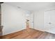 Spacious room with wood floors, crown molding, and double doors leading to another room at 109 New Spring Ct, Summerville, SC 29485