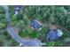 Aerial view showcases property among mature trees and neighborhood with nearby pool at 111 Coltsgate Ct, Summerville, SC 29485