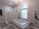 Bright bathroom featuring a shower, soaking tub, and a window with a view at 111 Coltsgate Ct, Summerville, SC 29485