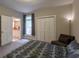 This bedroom is spacious with neutral carpet, ensuite bathroom and a window at 111 Coltsgate Ct, Summerville, SC 29485