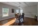 Dining room with natural lighting, a rustic table, and minimalist decor at 111 Coltsgate Ct, Summerville, SC 29485
