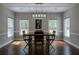 Dining room with natural lighting, a rustic table, and minimalist decor at 111 Coltsgate Ct, Summerville, SC 29485