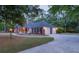 Brick home featuring an attached garage and circular driveway at 111 Coltsgate Ct, Summerville, SC 29485