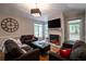 Cozy living room with fireplace, hardwood floors, and neutral colors at 111 Coltsgate Ct, Summerville, SC 29485