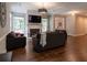 Open-concept living room with hardwood floors and views to dining area at 111 Coltsgate Ct, Summerville, SC 29485