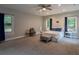 Spacious main bedroom featuring natural light, a ceiling fan, and neutral décor at 111 Coltsgate Ct, Summerville, SC 29485