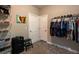 Organized walk-in closet with ample hanging space, shelving, and carpet at 111 Coltsgate Ct, Summerville, SC 29485