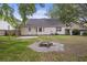 Inviting backyard with stone fire pit and ample space for outdoor activities at 111 Macfarren Ln, Summerville, SC 29485