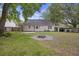 Charming home backyard with a well-maintained lawn and cozy stone fire pit at 111 Macfarren Ln, Summerville, SC 29485