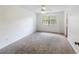 Spacious bedroom with neutral carpeting and a large window providing plenty of natural light at 111 Macfarren Ln, Summerville, SC 29485