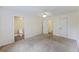 Large bedroom with neutral carpeting, ceiling fan, and an ensuite bathroom at 111 Macfarren Ln, Summerville, SC 29485